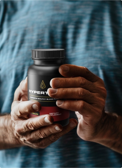 man holding hypertame bottle